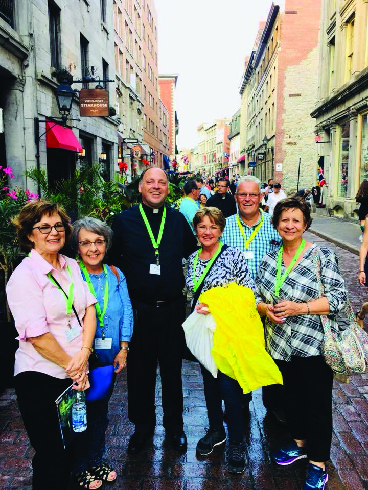 Group photo with Fr. Cedric Sonnier and other pilgrims in Montréal, Canada